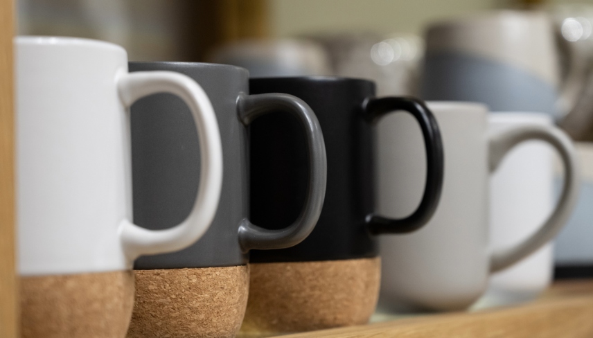 Mugs on the shelf. Ceramic mugs.