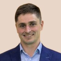 A professional headshot of Luke Gwenter