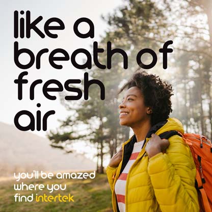 Hiker smiling while outside in the wilderness